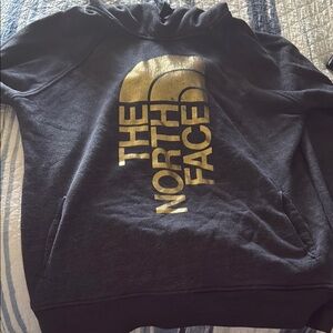 The North Face Black Hoodie with Gold Logo